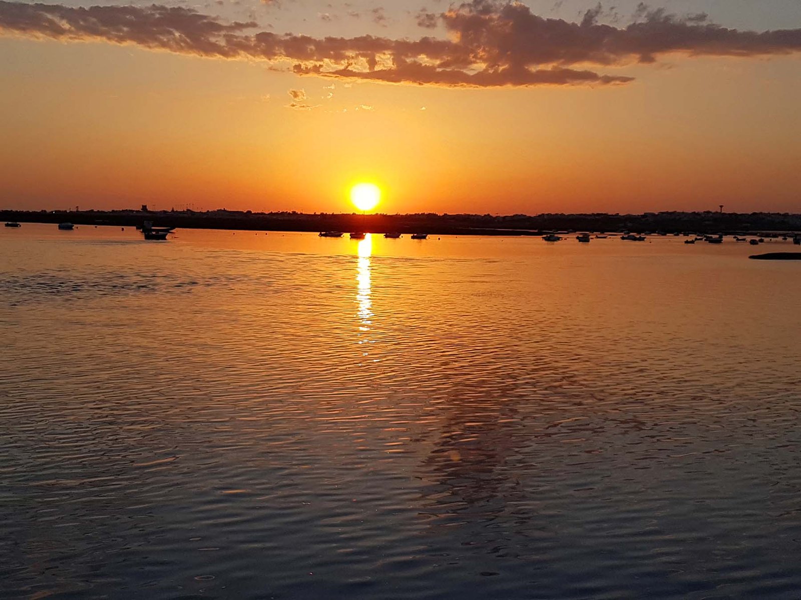 Por do sol em Faro no Algarve Por do sol em Faro no Algarve